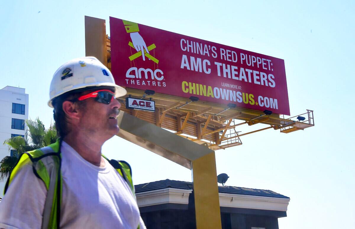 A billboard along Hollywood's famed Sunset Strip from the Center for American Security as part of its "China Owns US" campaign in Hollywood, Calif., on Aug. 29, 2016. The billboard highlights communist China's increasing influence over the U.S. movie industry, specifically AMC Entertainment, described as China's red puppet, following its 2012 sale to Chinese firm Dalian Wanda, closely aligned with the Chinese Communist Party, for $2.6 billion and control of 4,960 screens nationwide. (Frederic J. Brown/AFP via Getty Images)