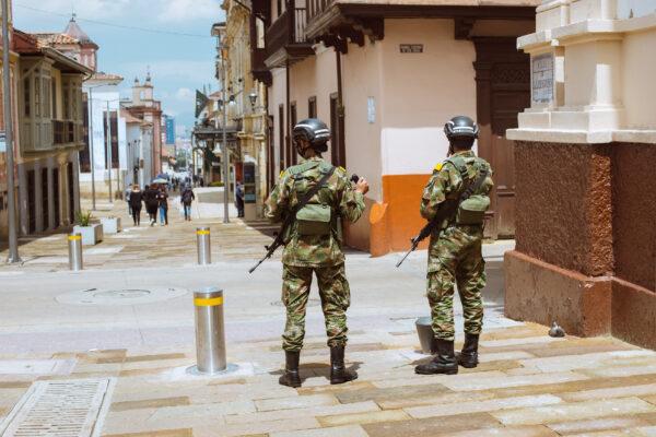 The military helping police patrol the streets in the La Candelaria neighborhood of Bogotá on Oct. 15, 2021. (Alejandro Gomez/The Epoch Times)