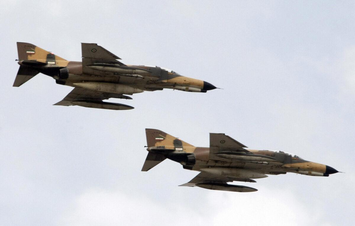 Iran's F-4 "Fantom" fighter jets fly during the annual army day military parade in Tehran on April 17, 2008. (Behrouz Mehri/AFP via Getty Images)