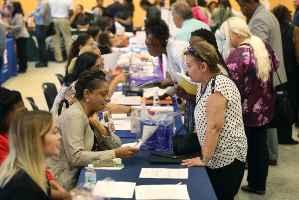 People attend a job fair put on by Miami-Dade County and other sponsors in Miami, Fla., on April 5, 2019. (Joe Raedle/Getty Images)