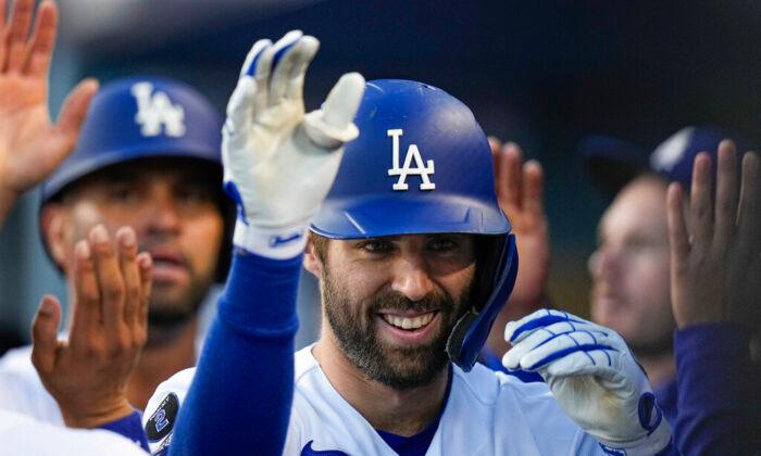 Chris Taylor of the Los Angeles Dodgers is congratulated after his two-run home run in the second inning against the Atlanta Braves in Game 5 of baseball's National League Championship Series in Los Angeles, Calif., on Thursday, Oct. 21, 2021. (Jae C. Hong/AP Photo)