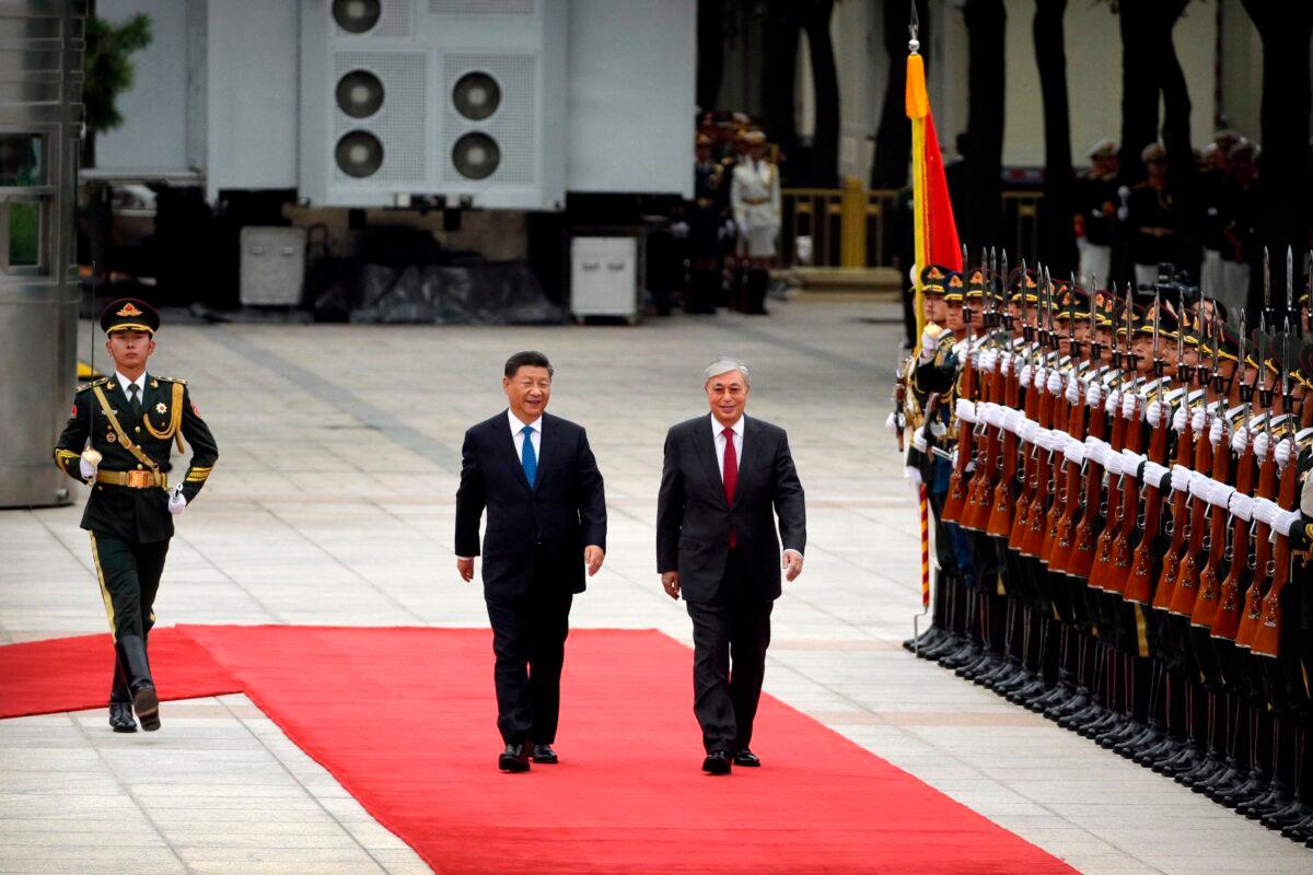 Chinese leader Xi Jinping and Kazakhstan President Kassym-Jomart Tokayev review an honor guard during a welcoming ceremony at the Great Hall of the People in Beijing on Sept. 11, 2019. (Mark Schiefelbein/AFP via Getty Images)