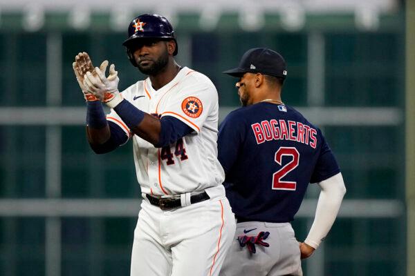 Houston Astros' Yordan Alvarez celebrates after a double against the Boston Red Sox during the fourth inning in Game 6 of baseball's American League Championship Series in Houston, Texas, on Oct. 22, 2021. (David J. Phillip/AP Photo)