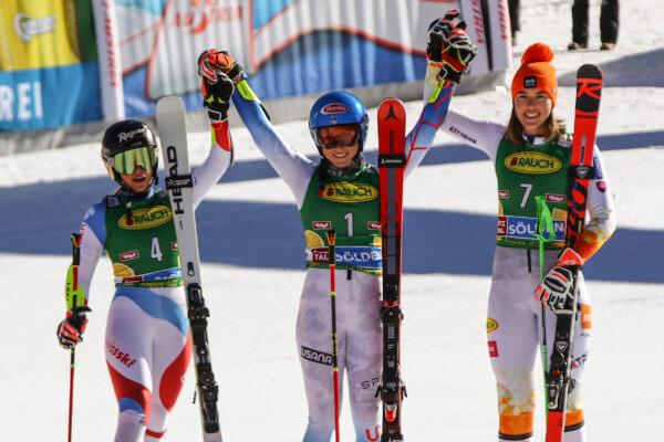 Winner United States' Mikaela Shiffrin (C) celebrates with second place Switzerland's Lara Gut-Behrami (L) and third place Slovakia's Petra Vlhova on the podium after an alpine ski, women's World Cup giant slalom, in Soelden, Austria, on Oct. 23, 2021. (Marco Trovati/AP Photo)