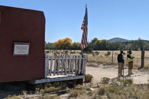Security guards stand at the entrance of Bonanza Creek Ranch in Santa Fe, N.M., on Oct. 22, 2021. (Anne Lebreton/AFP via Getty Images)