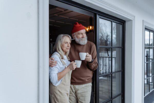 A senior couple drinking a cup of coffee and relaxing. (Mart Production/Pexels)