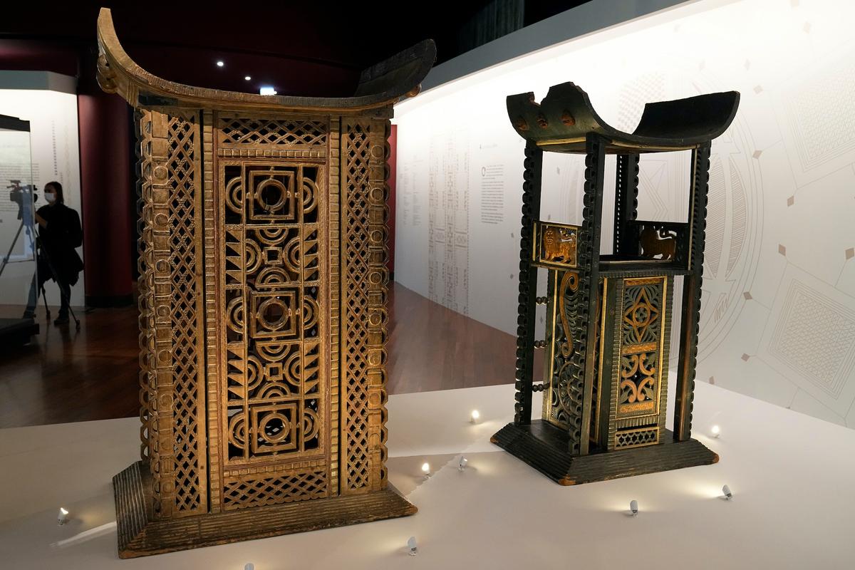 The 19th century Throne of King Ghezo (L), and Throne of King Glele, from Benin, are pictured at the Quai Branly–Jacques Chirac museum in Paris, on Oct. 25, 2021. (Michel Euler/AP Photo)