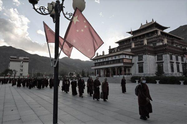 This photograph taken during a government organised media tour in Lhasa, China's central Tibet Autonomous Region, on May 31, 2021 shows monks having a walk after the class at the Tibet Autonomous Region Buddhist College. (Hector Retamal/AFP via Getty Images)