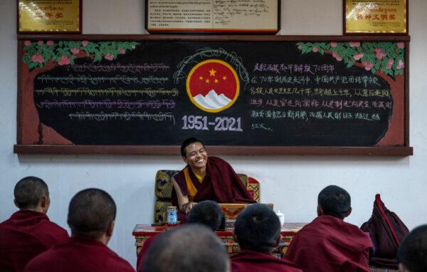 Tibetan Buddhist monks attend class during a government organised a visit to the Buddhist College of the Tibet Autonomous Region in Qushui County, outside Lhasa, Tibet Autonomous Region, on May 31, 2021. (Kevin Frayer/Getty Images)