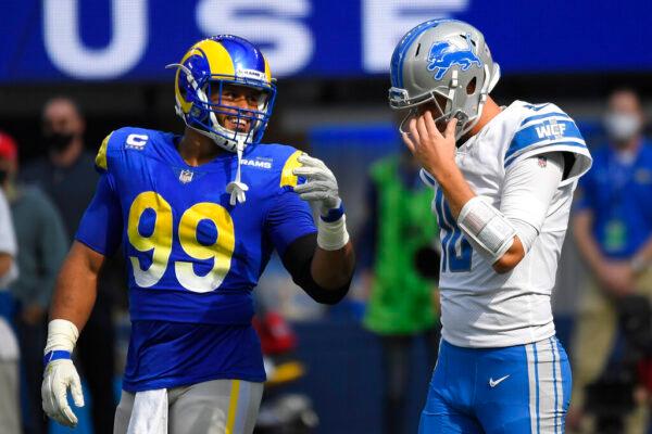 Detroit Lions quarterback Jared Goff (R) talks with Los Angeles Rams defensive end Aaron Donald during the first half of an NFL football game in Inglewood, Calif., on Oct. 24, 2021. (Kevork Djansezian/AP Photo)