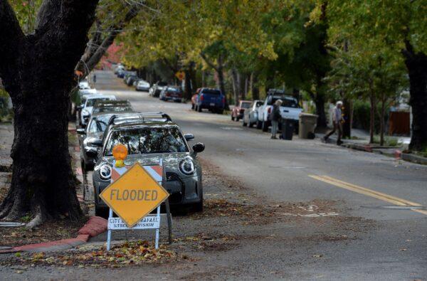 A flooded sign remains after water had receded on C Street in San Rafael, Calif., on Oct. 25, 2021. (Alan Dep/Marin Independent Journal via AP)