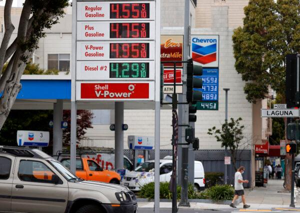 Gas prices nearing $5.00 a gallon are displayed at Chevron and Shell stations in San Francisco, Calif., on July 12, 2021. (Justin Sullivan/Getty Images)