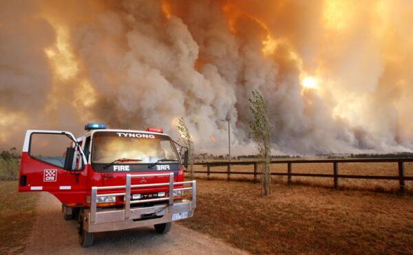 Country Fire Authority (CFA) staff monitor a giant fire raging in the Bunyip State Park, some 125 kilometres west of Melbourne, Australia, on Feb. 7, 2009. (William West/AFP via Getty Images)