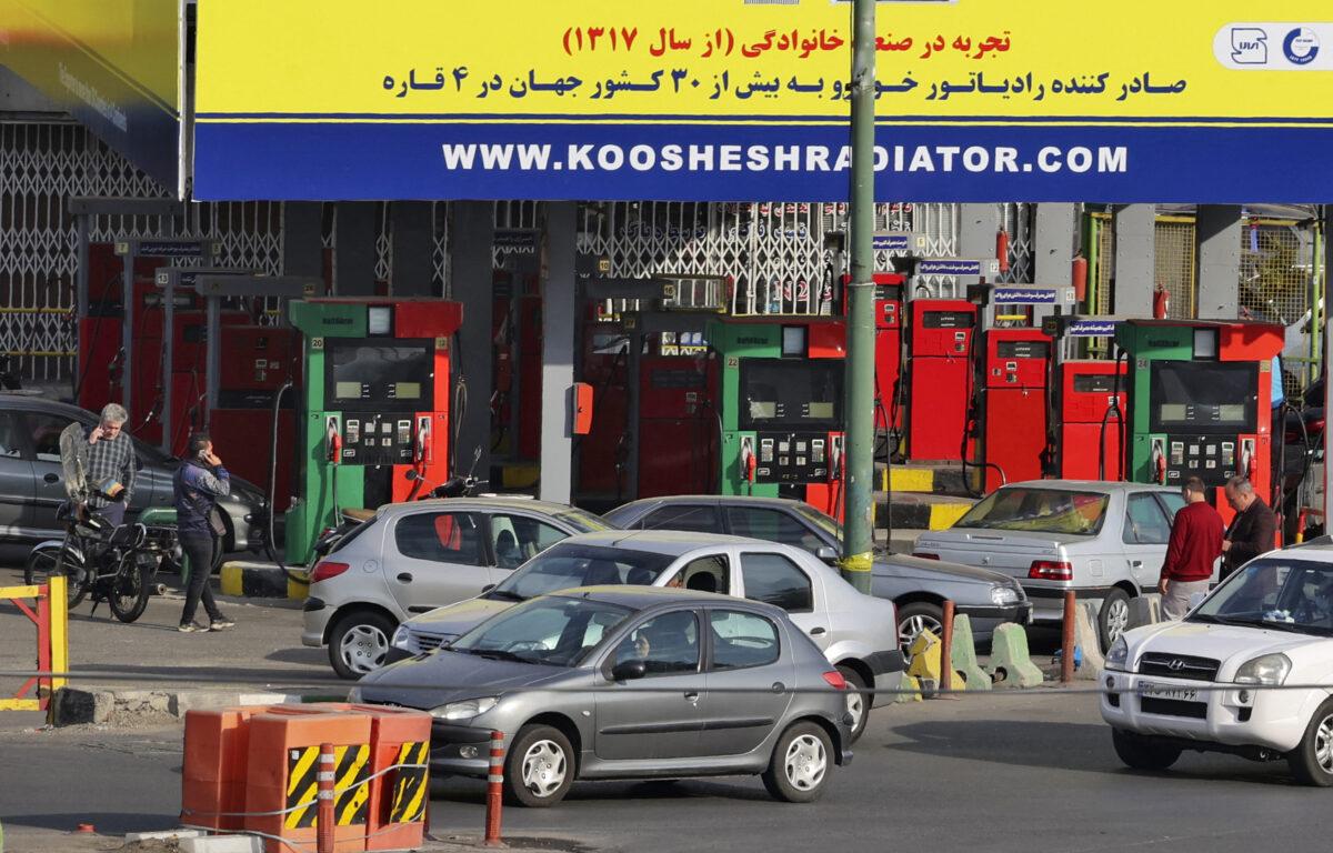 Cars and motorbikes queue to fill up at a service station in Tehran, Iran, amid a nationwide disruption of the petrol distribution system on Oct. 26, 2021. (Atta Kenare/AFP via Getty Images)