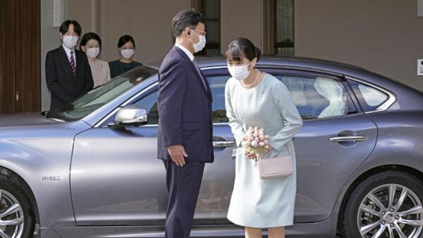 Japan's Princess Mako bows before leaving her home in Akasaka Estate in Tokyo, Japan, on Oct. 26, 2021. (Koki Sengoku/Kyodo News via AP)