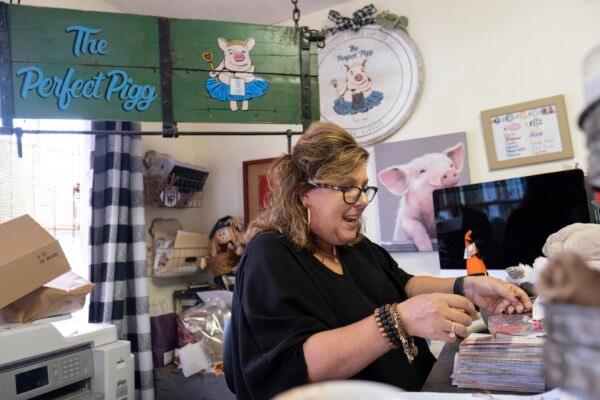 Ginger Pigg in her gift boutique The Perfect Pigg in Cumming, Ga., on Oct. 22, 2021. (Ben Gray/AP Photo)