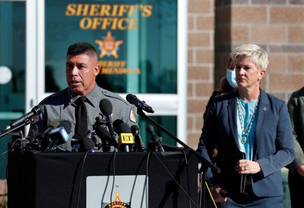 Santa Fe County Sheriff Adan Mendoza (L) speaks as Santa Fe District Attorney Mary Carmack-Altwies (R) listens during a news conference in Santa Fe, N.M., on Oct. 27, 2021. (Andres Leighton/AP Photo)