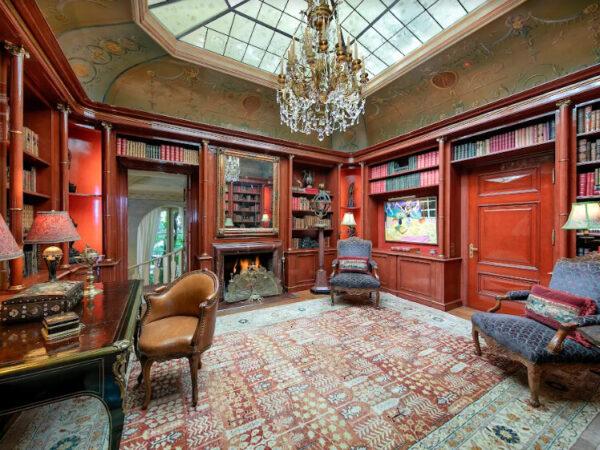 The villa’s aptly named “Red Library” features hand-lacquered paneling and a cove ceiling with a skylight. (Jim Bartsch/Jade Mills)