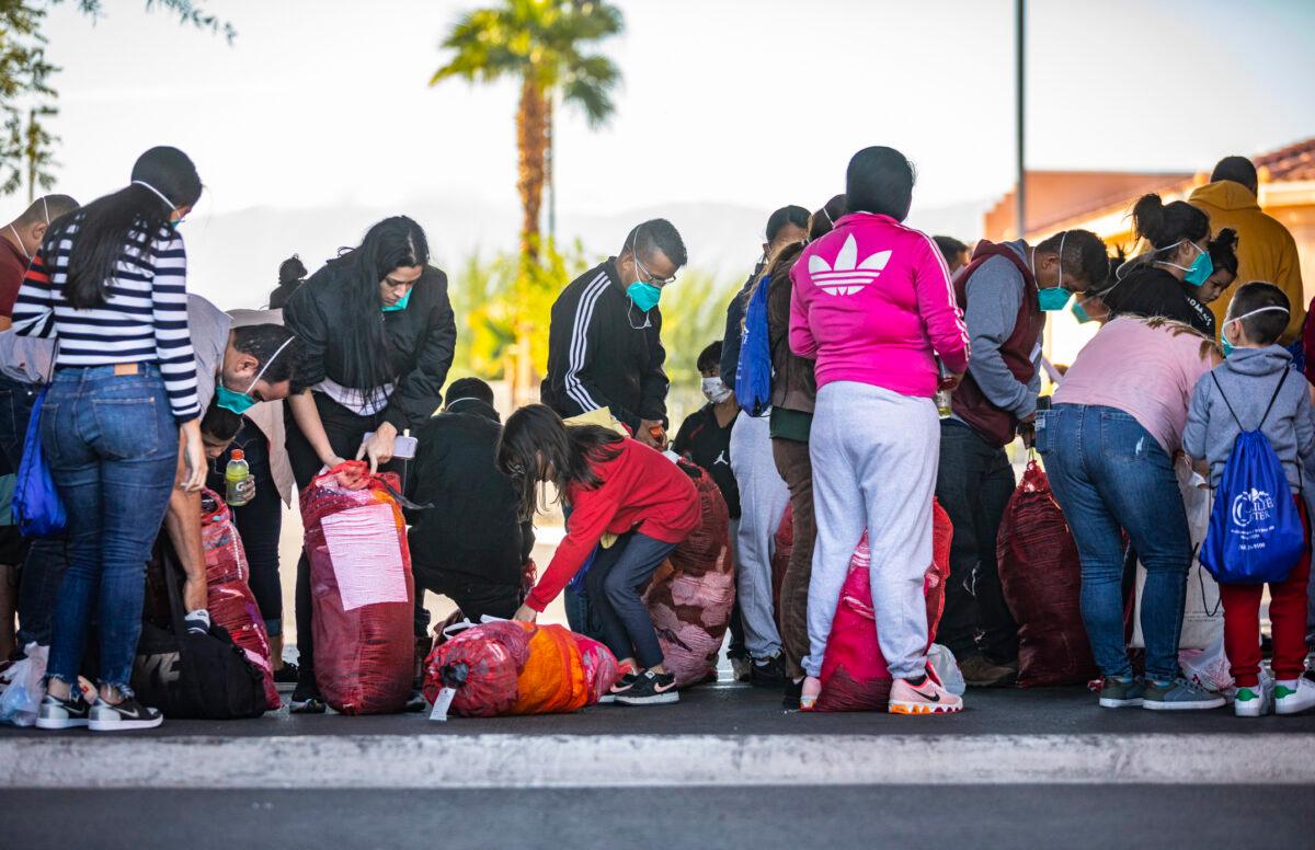 Immigrants held by border patrol agents are transferred to a hotel in Indio, Calif., on Oct. 18, 2021. (John Fredricks/The Epoch Times)