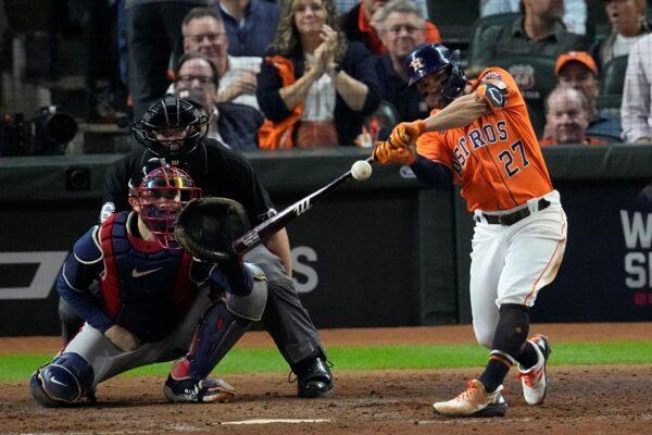 Houston Astros' Jose Altuve hits a home run during the seventh inning in Game 2 of baseball's World Series between the Houston Astros and the Atlanta Braves in Houston, Texas, on Oct. 27, 2021. (Sue Ogrocki/AP Photo)