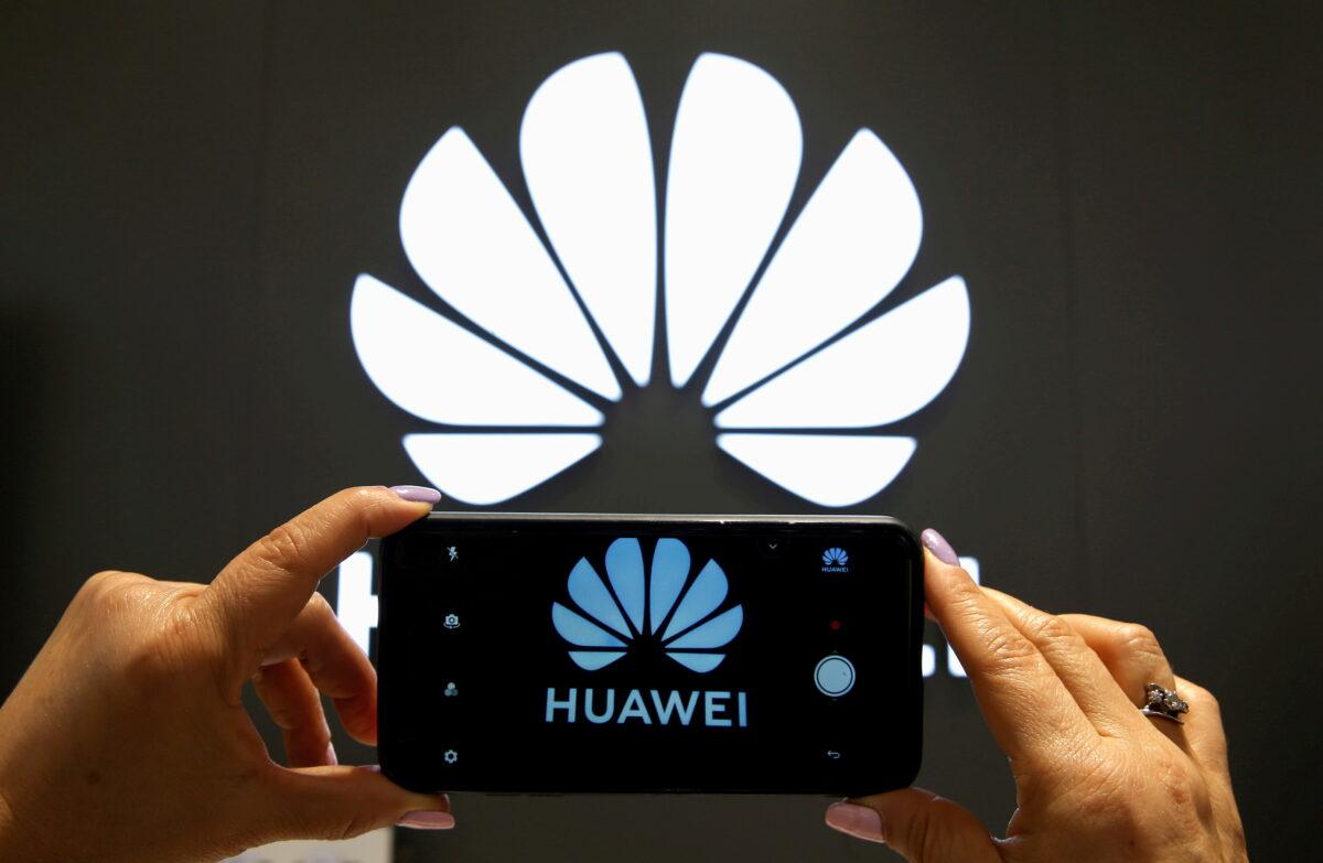 A Huawei logo on a cell phone screen in their store at Vina del Mar, Chile, on July 18, 2019. (Rodrigo Garrido/Reuters)