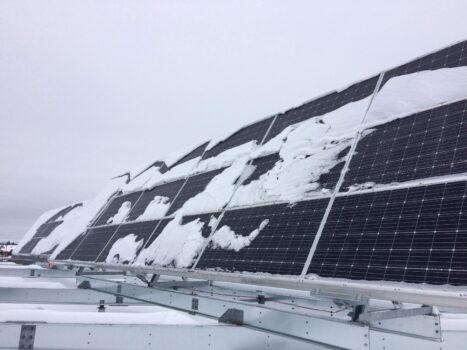 Solar panels are shown on the roof of Fredericton High School in Fredericton, N.B. on Dec. 12, 2017. (The Canadian Press/Kevin Bissett)
