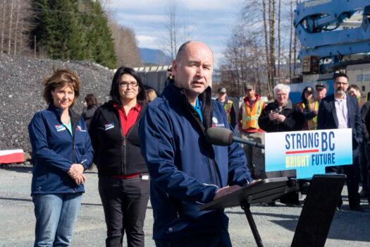 Ellis Ross, the MLA and B.C. Liberal candidate for the Skeena riding, speaks to supporters while BC Liberal Leader Christy Clark (L) and Stikine riding Liberal candidate Wanda Good look on, in Kitimat, B.C., on April 13, 2017. (The Canadian Press/Robin Rowland)