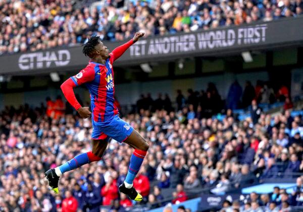 Crystal Palace's Wilfried Zaha celebrates scoring during the English Premier League soccer match between Manchester City and Crystal Palace at the Etihad Stadium, Manchester, England on Oct. 30, 2021. (Martin Rickett/PA via AP)