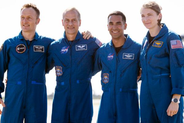 From left, European Space Agency astronaut Matthias Maurer of Germany, and NASA astronauts Tom Marshburn, Raja Chari, and Kayla Barron gather for a photo after arriving at the Kennedy Space Center in Cape Canaveral, Fla., Oct. 26, 2021. (Joel Kowsky/NASA via AP)