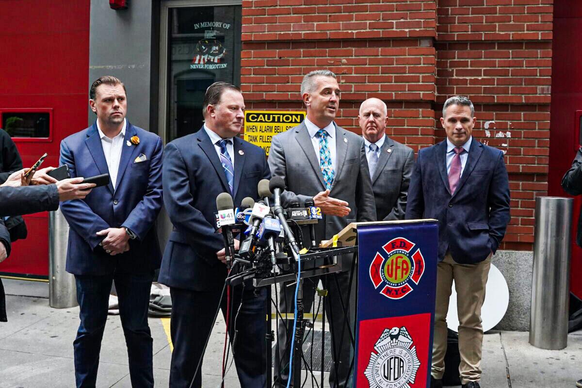Firefighter Union leaders speak to reporters in Manhattan, New York, on Oct. 29, 2021 (Enrico Trigoso/The Epoch Times)