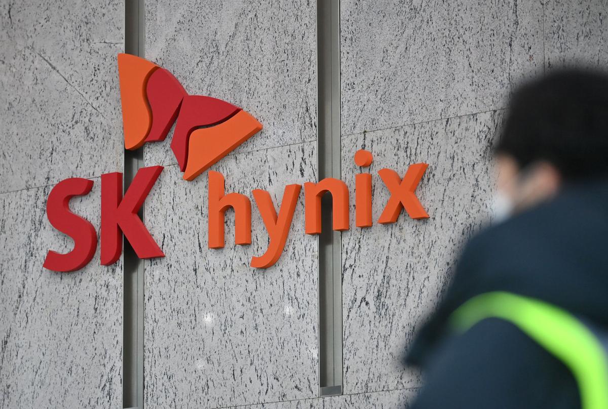 A man walks past an SK Hynix logo in the lobby of the company's Bundang office in Seongnam on Jan. 29, 2021. (Jung Yeon-je /AFP via Getty Images)