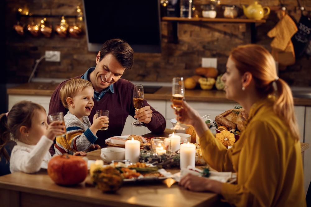 Don't forget to toast to the heart of the holiday: Gathering with family and friends to share a meal and give thanks for all we have. (Drazen Zigic/Shutterstock)