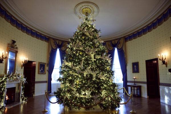 The official White House Christmas Tree stands in the Blue Room of the White House during a press preview of the holiday decorations on Nov. 29, 2021. (Alex Wong/Getty Images)