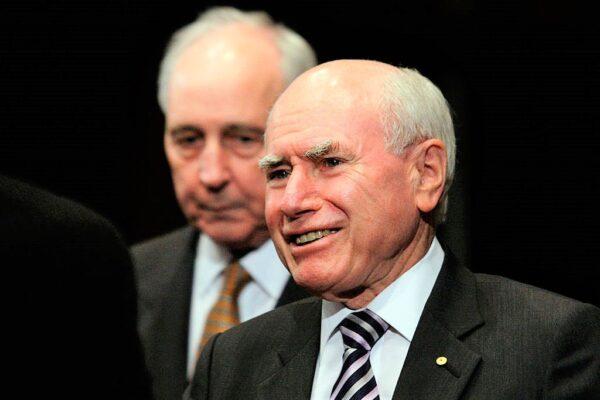 Former Australian Prime Ministers John Howard (R) and Paul Keating greet each other at the Annual Lowy Lecture in Sydney, Australia, on Nov. 7, 2014. (Lisa Maree Williams/Getty Images)