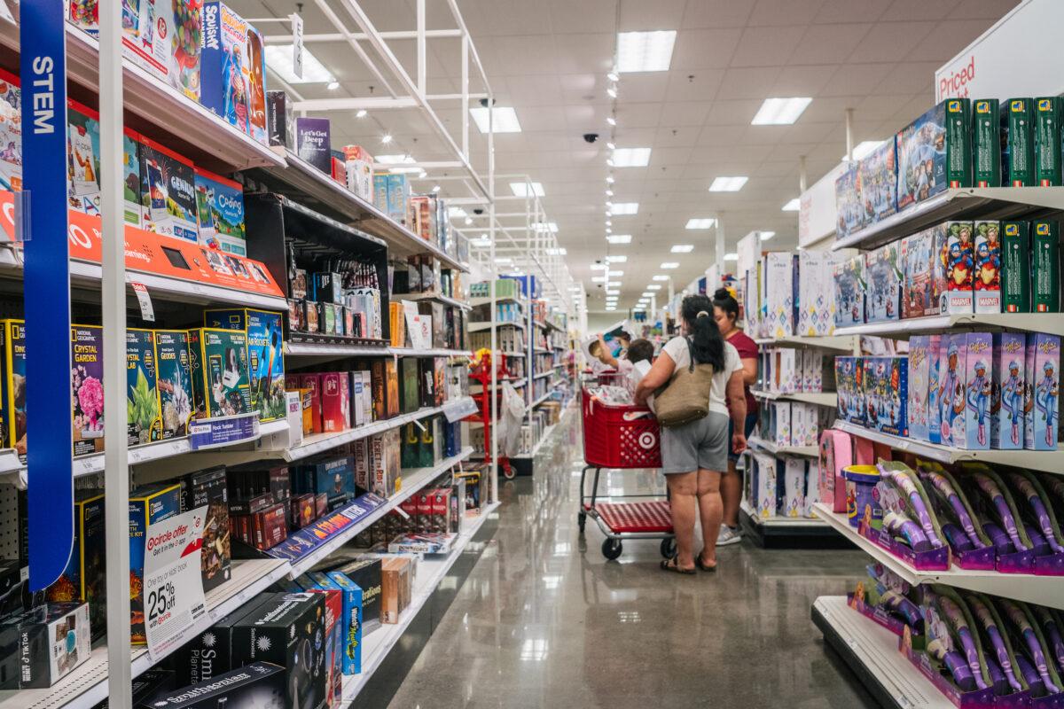 A family shops for toys at a Target store in Houston, on Oct. 25, 2021. (Brandon Bell/Getty Images)
