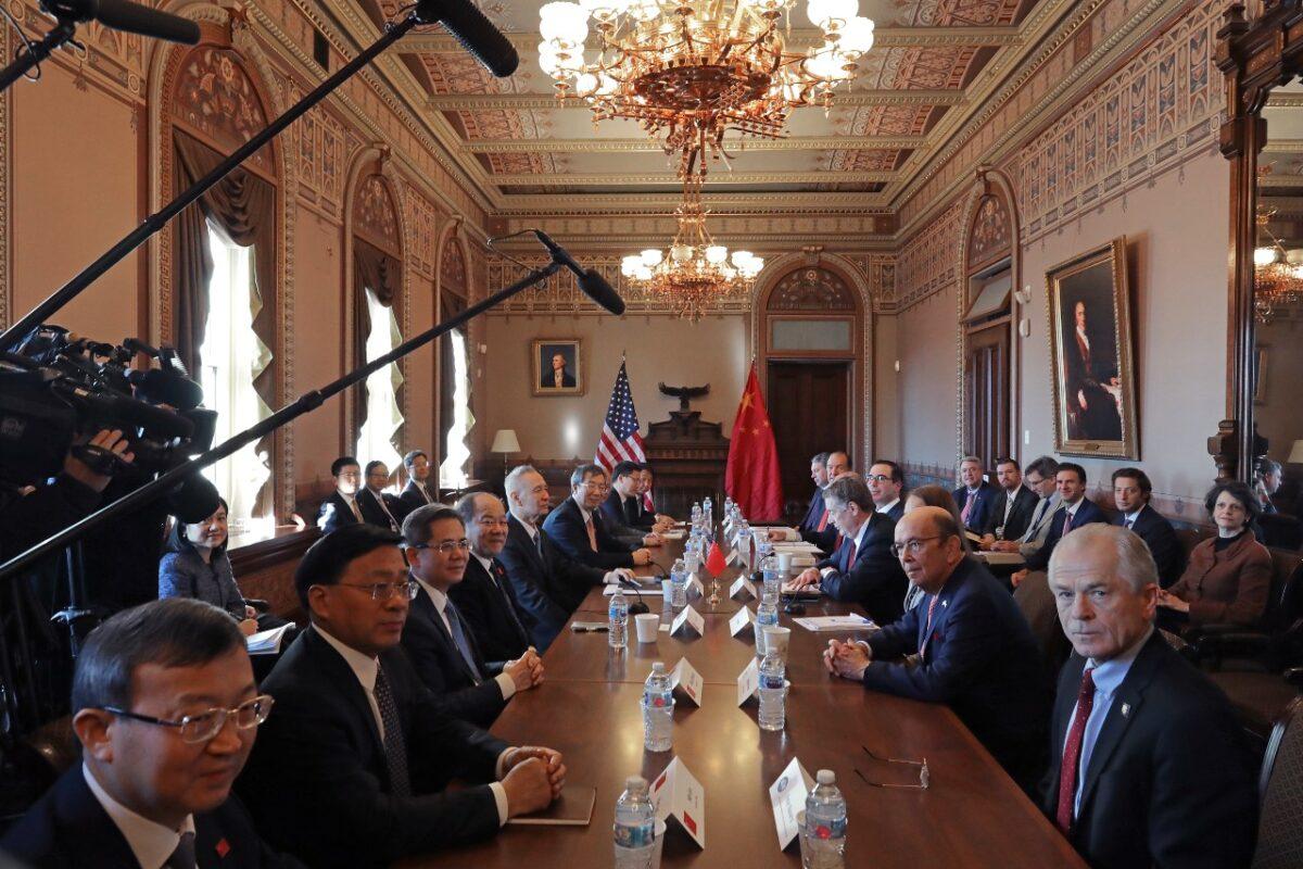 (R-L) White House Director of the Office of Trade and Manufacturing Policy Peter Navarro, Commerce Secretary Wilbur Ross, U.S. Trade Representative Robert Lighthizer, Treasury Secretary Steven Mnuchin and other Trump Administration officials sit down with Chinese Vice Premier Liu He (5th L), Central Bank Governor Yi Gang (6th L) and other Chinese vice ministers and senior officials for negotiations in the Diplomatic Room at the Eisenhower Executive Office Building in Washington on Jan. 30, 2019. (Chip Somodevilla/Getty Images)
