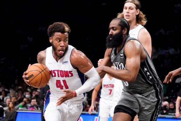 Detroit Pistons forward Saddiq Bey (41) drives around Brooklyn Nets guard James Harden during the first half of an NBA basketball game in New York on Oct. 31, 2021. (Corey Sipkin/AP Photo)