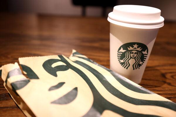 The Starbucks logo is display on a cup and bag at a Starbucks store in San Francisco on Oct. 29, 2021. (Justin Sullivan/Getty Images)