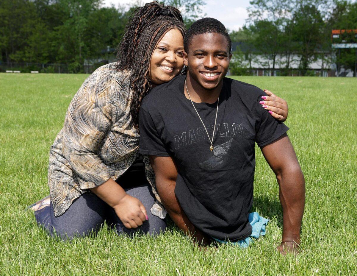 Legless athlete and world record holder Zion Clark with his adoptive mother Kimberly Clark Hawkins. (Courtesy of Zion Clark)