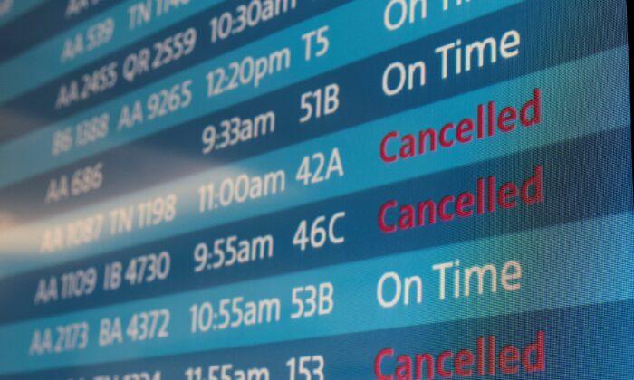 A screen displays canceled flights is seen at Los Angeles International Airport on Oct. 31, 2021. (Carlos Barria/Reuters)