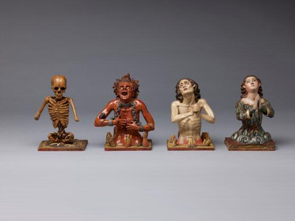 “The Four Fates of Man,” circa 1775, attributed to Manuel Chili, known as Caspicara. (L–R): “Death,” 7 inches by 4 5/8 inches by 3 1/4 inches; “Soul in Hell,” 7 inches by 5 3/4 inches by 3 1/8 inches; “Soul in Purgatory,” 6 5/8 inches by 4 3/8 inches by 4 7/8 inches; and “Soul in Heaven,” 6 7/8 inches by 4 3/8 inches by 4 7/8 inches. Polychromed wood, glass, and metal. (The Hispanic Society Museum & Library)