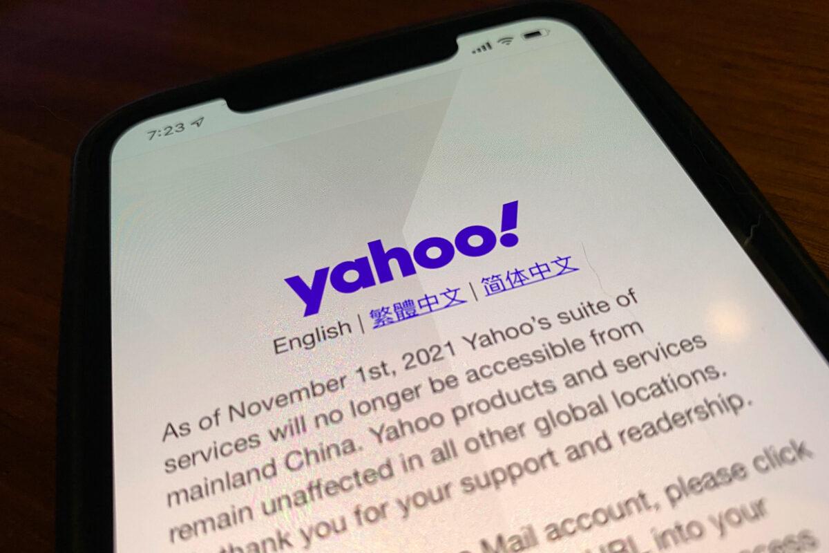 A smart phone shows the home page of Yahoo when accessed inside China in Beijing, China, on Nov. 2, 2021. (AP Photo/Ng Han Guan)