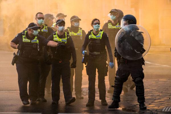 Police use pepper spray bullets during a protest at the CFMEU headquarters in Melbourne, Australia, on Sept. 20, 2021. (Darrian Traynor/Getty Images)