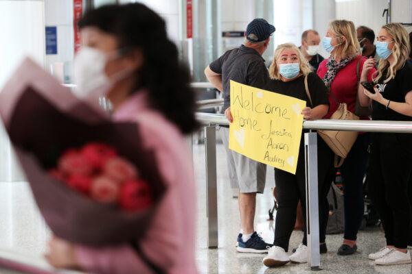 Family and friends await the arrival of incoming flights at Sydney’s International Airport in Sydney, Australia, on Nov. 1, 2021. (Lisa Maree Williams/Getty Images)