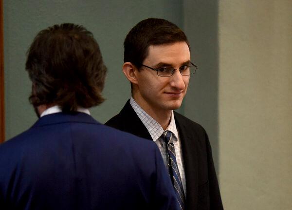 Joseph Elledge walks into the Boone County Courtroom with one of his attorneys Matei Stroescu on the first day of testimony of his trial in Boone County, Mo, on Nov. 2, 2021. (Don Shrubshell/Columbia Daily Tribune via AP, Pool)