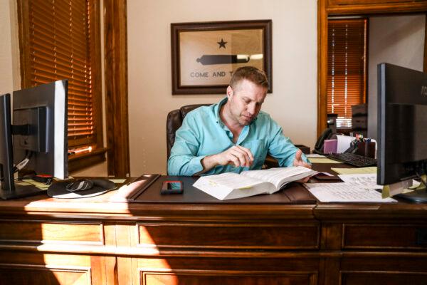Kinney County Attorney Brent Smith in his office in Brackettville, Texas, on Oct. 29, 2021. (Charlotte Cuthbertson/The Epoch Times)