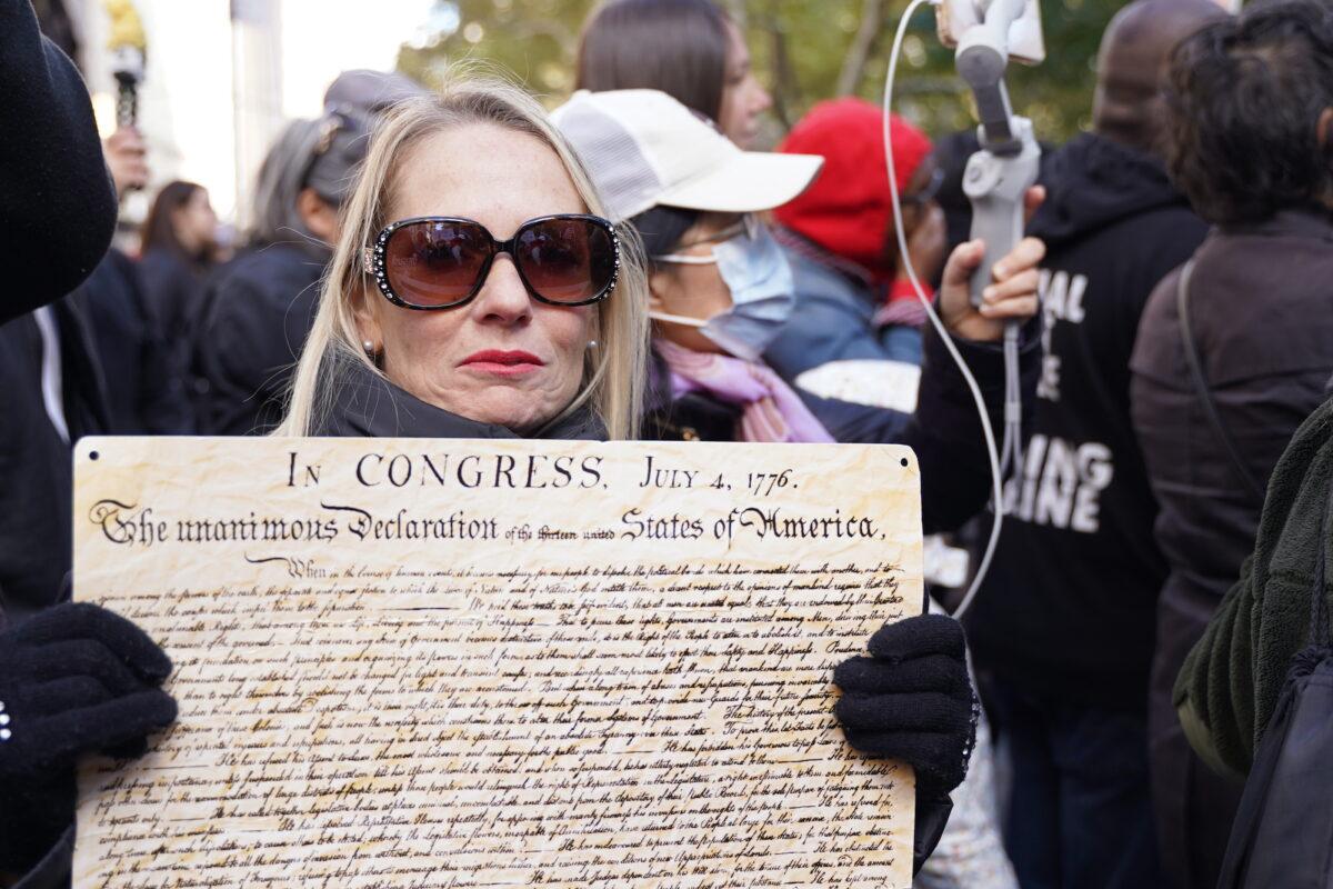 A protester outside New York City Hall on Nov. 3, 2021. (Enrico Trigoso/The Epoch Times)
