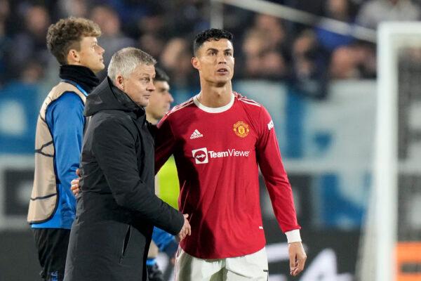 Manchester United's manager Ole Gunnar Solskjaer approaches Manchester United's Cristiano Ronaldo at the end of the Champions League group F soccer match between Atalanta and Manchester United, at the Stadio di Bergamo, in Bergamo, Italy on Nov. 2, 2021. (Luca Bruno/AP Photo)