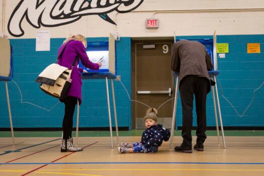 Mayor Jacob Frey casts his vote on Election Day alongside his family at the Marcy Arts Magnet Elementary School in Minneapolis on Nov. 2, 2021. (AP Photo/Christian Monterrosa)