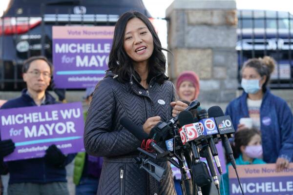 Michelle Wu faces reporters after casting her ballot at a polling station, in the Roslindale neighborhood, of Boston, on Nov. 2, 2021. (AP Photo/Steven Senne)